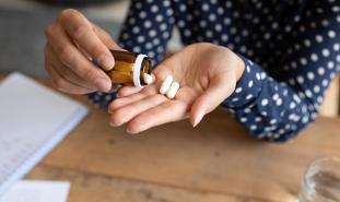 Woman pours out pills