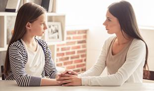 teen girl talking to parent